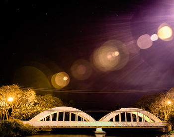 Low angle view of illuminated bridge