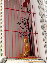 Low angle view of statue against temple