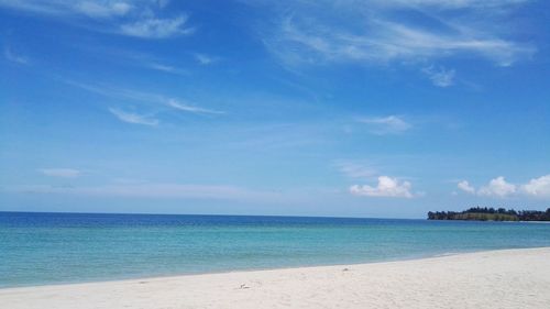 Scenic view of sea against blue sky