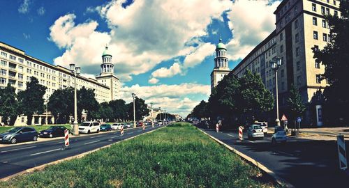 City street against cloudy sky