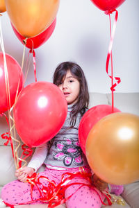High angle view of girl with balloons