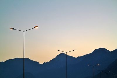 Low angle view of street light against sky