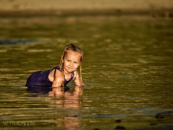 Young woman swimming in sea