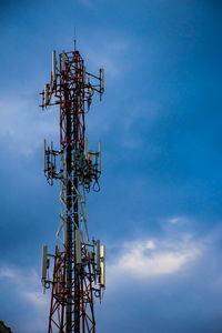 Low angle view of communications tower against sky