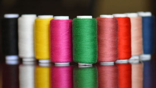 Close-up of multi colored spools