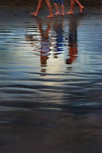 Low section of people standing in water