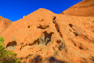 Rock formations in desert against clear blue sky