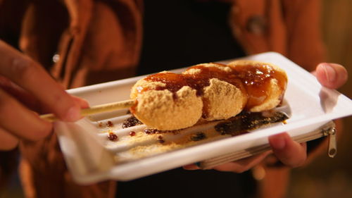 Close-up of woman holding food