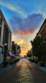 Buildings in city at sunset