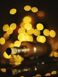 Close-up of illuminated lights on table