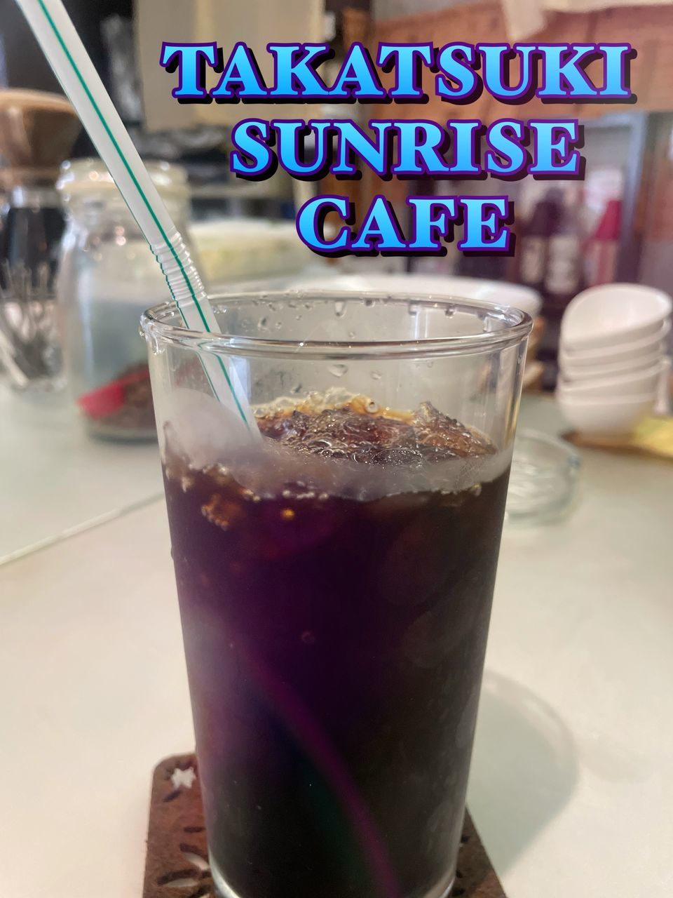 soft drink, food and drink, drink, refreshment, household equipment, drinking glass, glass, food, straw, drinking straw, cafe, cold temperature, text, cold drink, alcoholic beverage, table, healthy eating, freshness, indoors, western script, ice cube, frozen, no people, close-up, communication