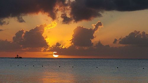Scenic view of sea against sky at sunset