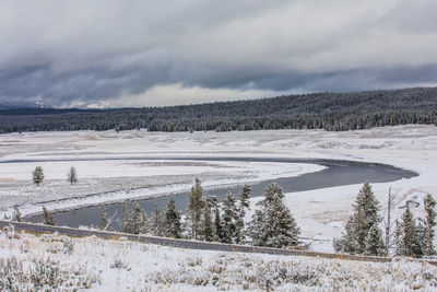 Scenic view of frozen landscape against sky