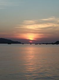 Scenic view of sea against sky at sunset