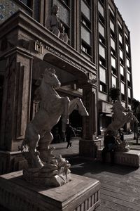 Low angle view of statue in city