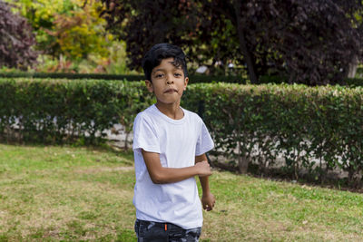 Young boy alone. having fun in a park.