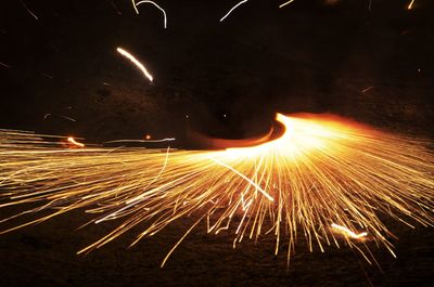 View of firework display at night