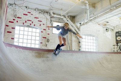 Young woman skateboarding.