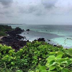 Scenic view of sea against cloudy sky