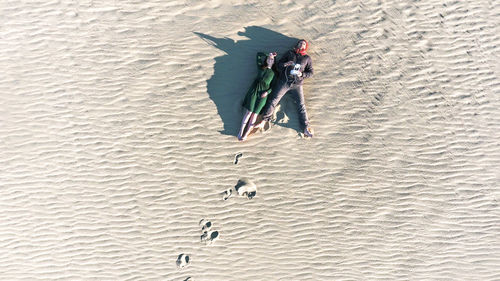 High angle view of man with umbrella on beach