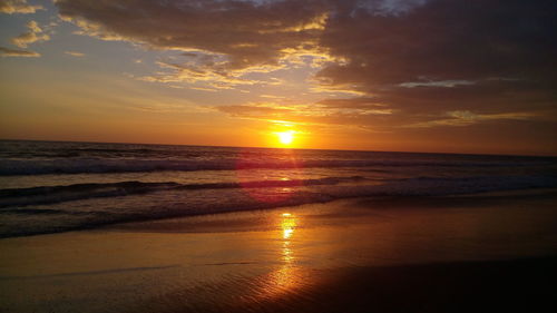 Scenic view of sea at sunset