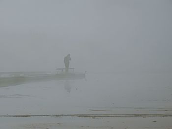 Scenic view of sea against sky during foggy weather