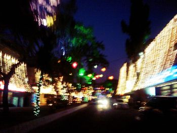 Vehicles on city street at night