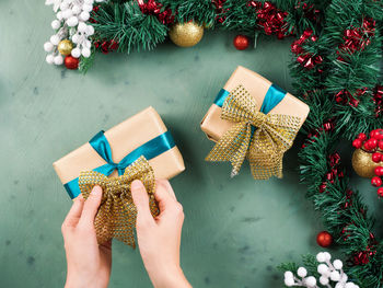 Low section of woman with christmas tree in box