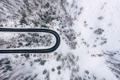 View of snow covered car on road