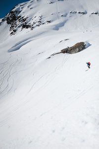 Person skiing on snow covered land
