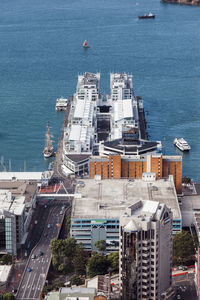 High angle view of harbor by buildings in city