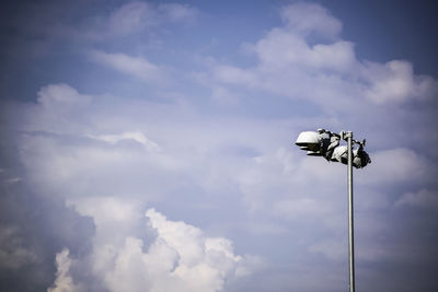 Low angle view of floodlight against sky