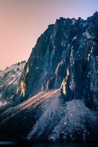 Snowcapped mountains against clear sky during winter