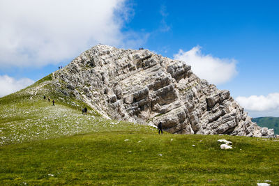 Low angle view of rocks against sky