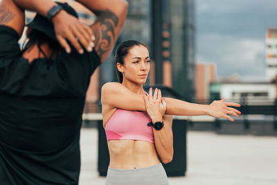 Portrait of young woman exercising in gym