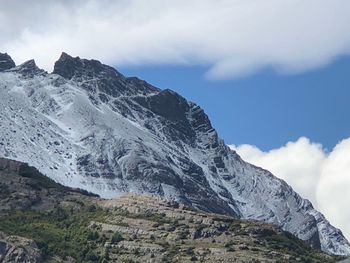 Low angle view of snowcapped mountain against sky