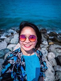 Portrait of a smiling young woman in sea
