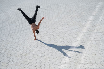 High angle view of woman walking on street