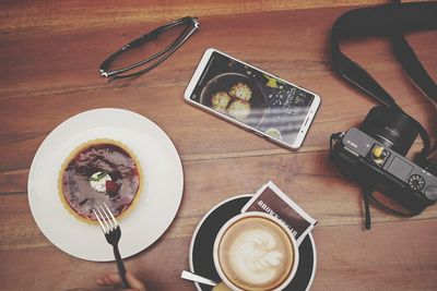 High angle view of coffee served on table