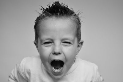 Close-up portrait of boy shouting