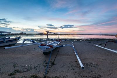 Scenic view of beach against sky during sunset