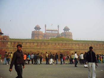 Group of people in front of historical building