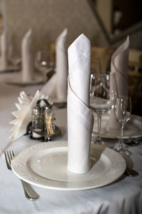 Close-up of glasses on table in restaurant