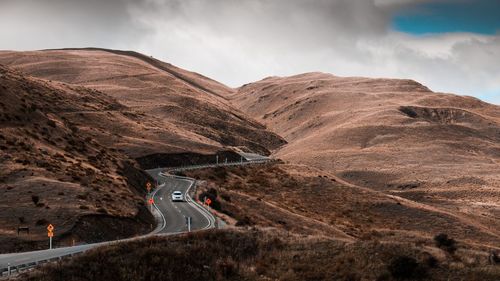 Scenic view of mountain road against sky