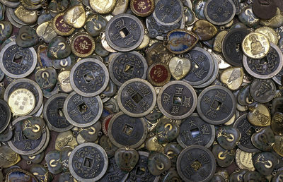 Full frame shot of coins and pendants