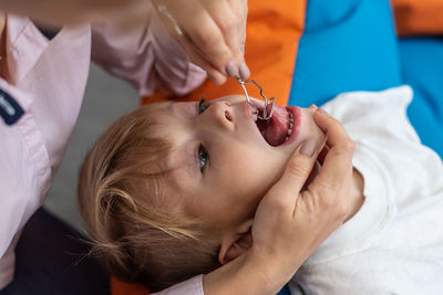 Midsection of doctor examining patient