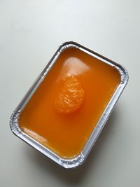 High angle view of orange juice on table