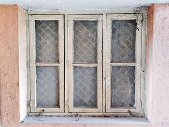 Closed window of old building