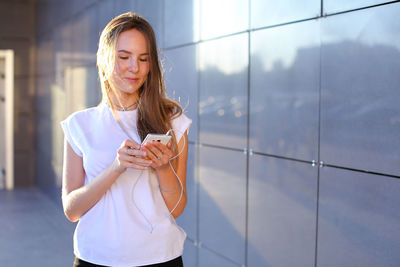 Young woman using mobile phone