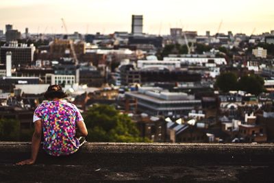 Woman looking at cityscape